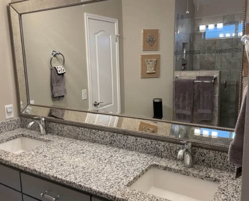 Large bathroom glass mirror installation by Shades of Texas